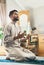 To pray well is the better half of study. a young muslim man praying in the lounge at home.