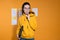 To present your project in front of colleagues or partners, a young woman in a yellow hoodie,