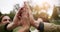 To a successful picnic and a great friendship. Shot of unrecognizable friends having a picnic outside.