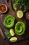 Toast with avocado roses on wooden cutting board