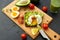 Toast bread with avocado, eggs and cherry tomatoes