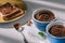 toast bread with chocolate and bowls with cocoa powder on white