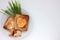 Toast bread with fried egg in a heart shaped hole and greens on plate on white background.