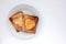 Toast bread with fried egg in a heart shaped hole on plate on white background. Creative Valentine\\\'s day