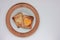 Toast bread with fried egg in a heart shaped hole on plate on white background. Creative Valentine\\\'s day