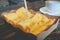 Toast bread with sweetened condensed milk on wood table