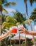 toast with fruity cocktails on the beach