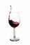 A Toast with Red Wine. Splash, white background. Splashing red wine on balloon glasses