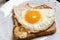 Toast sandwich with fried egg on a plate. Light, quick snack