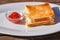 Toast sandwich with ham and molten cheese,