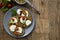 Toast sandwich mozzarella cheese, cherry tomatoes and pesto bruschetta, toast on wooden background. Healthy breakfast, snack. Copy