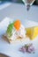 Toast Skagen shrimp sandwich on white table with citrus on the s