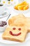 Toast with a smile of jam, coffee, fresh oranges for breakfast