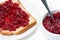 Toast with sweet cranberry jam, closeup