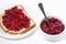 Toast with sweet cranberry jam on white table