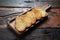 Toasted baguette slices on rustic wooden kitchen table