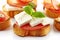 Toasted bread with fresh goat cheese and tomato