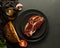 Toasted bread with Iberian ham on black plates and rustic background - zenith vision