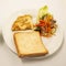 Toasted Bread sandwich with spicy omelet and tomato and green leaf salad