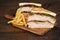 Toasted chicken club sandwich with fries