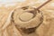 Toasted manioc flour into a bowl