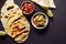Toasted Mexican tortilla Quesadillas with guacamole and salsa sauces with pepper