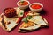 Toasted Mexican tortilla Quesadillas with guacamole and salsa sauces with pepper