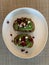 Toasted sourdough bread topped with avocado, feta and pomegranate