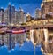 Toasting with champagne against Dubai marina in United Arab Emirates