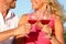 Toasting glasses - couple drinking red wine