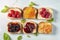 Toasts with colorful jams, a mouthwatering breakfast delight captured in a delightful flat lay. AI Generated