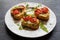 Toasts (Crostini) with ricotta, cherry tomatoes and arugula