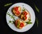 Toasts (Crostini) with ricotta, cherry tomatoes and arugula