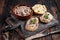 Toasts with Duck pate Rillettes de Canard on wooden board. Dark wooden background. Top View