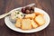 Toasts with fish pate and olives on plate