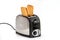 Toasts jumping out of retro style black and metallic toaster on white background