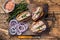 Toasts with sardine, cream cheese and onion. Wooden background. Top view