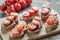 Toasts with tahini and mint sauce and cherry tomatoes