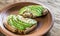 Toasts with tahini sauce and sliced avocado