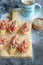 Toasts with tuna, tomatoes and pickled onion