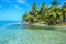 Tobacco Caye - Relaxing on Wooden Pier on small tropical island at Barrier Reef with paradise beach, Caribbean Sea, Belize,