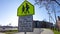 Tobacco Free Zone sign with student crossing sign in front of a public school in Maryland.