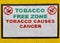 Tobacco free zone warning painted on the yellow wall