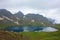 Tobavarchkhili lake with a snowy mountain pass in Caucasus Mountains on a hike to Silver Lakes in Georgia