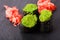 Tobiko green sushi and red marinated ginger slices