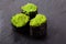 Tobiko green sushi set on the slate background