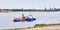 Tobolsk, Russia Barge with cars, special vehicles and people swims along the Irtysh river. Banner