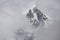 Tobuche Peak, in Stormy Clouds. Trek to Everest Base Camp