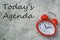 Today agenda inscription with red clock, flat lay background