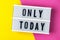 Only today - text on a display lightbox on yellow and pink background